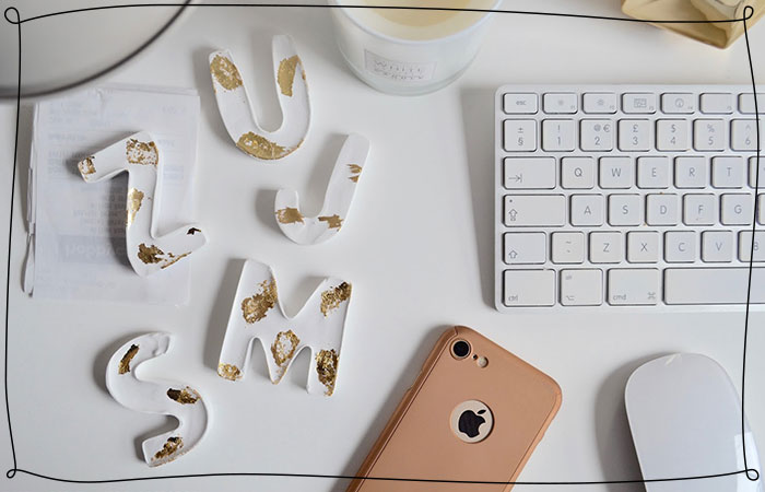 white and gold paper weights on a desk